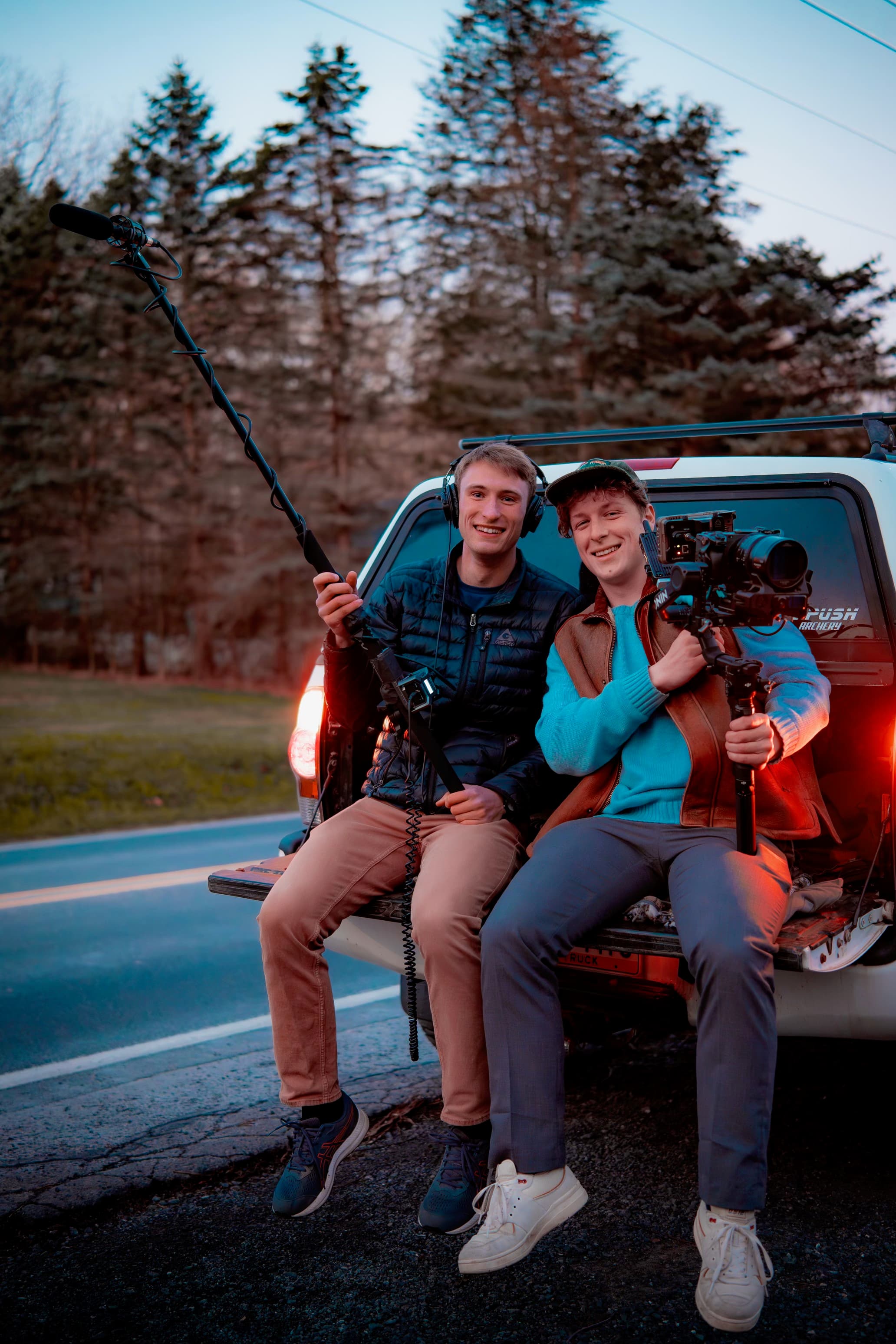 Marco holding a camera with a boom operator